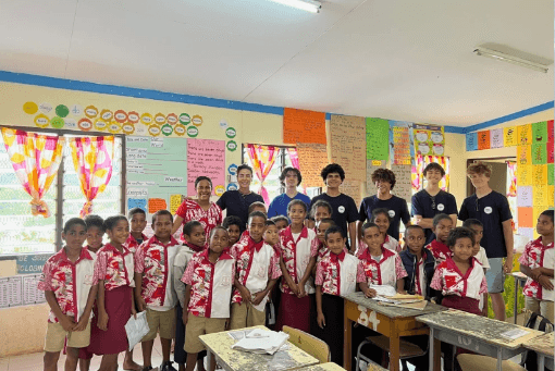 OOCSA visitors and students gathered together in a Fiji classroom