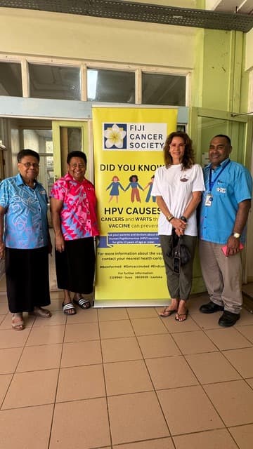 OOCSA and healthcare partners standing beside a Fiji Cancer Society health education banner at Levuka Hospital