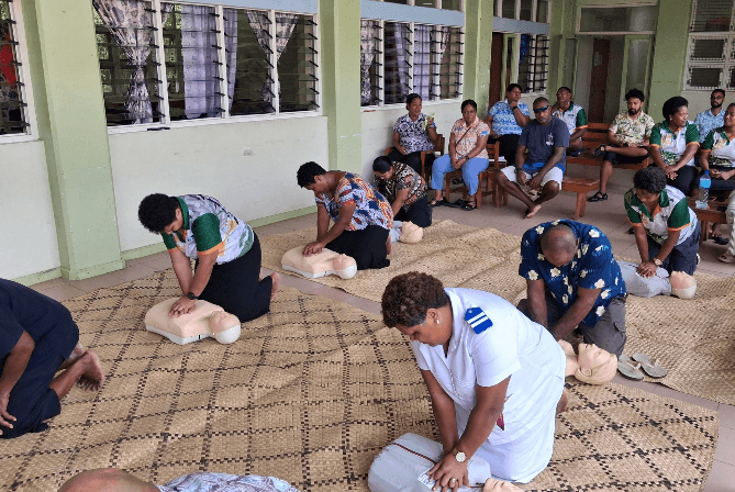 Community members practicing CPR during an OOCSA training session